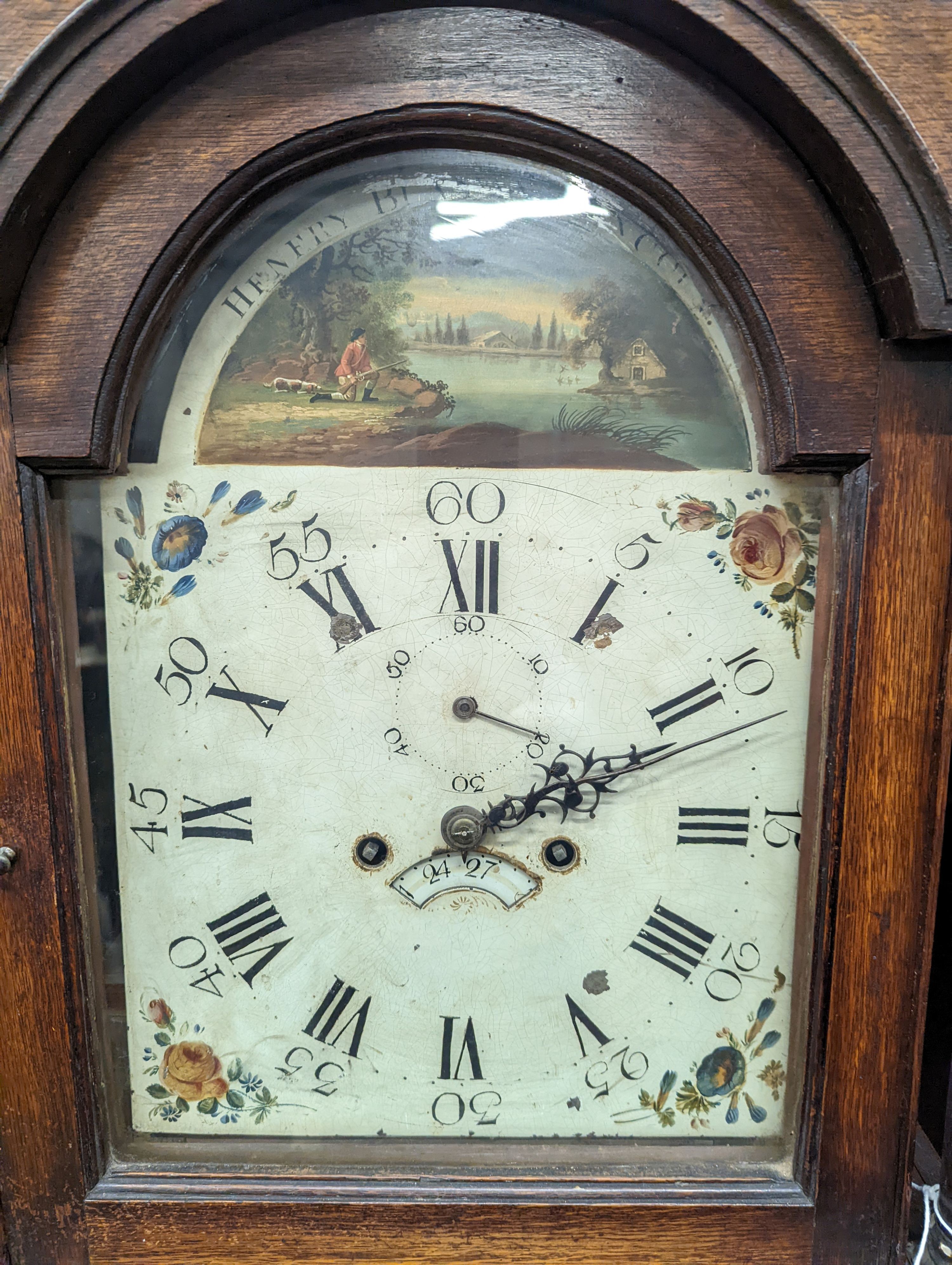An early 19th century oak eight day longcase clock, the painted dial marked Henry Bunyan, Lincoln, (case in two sections) height 224cm
